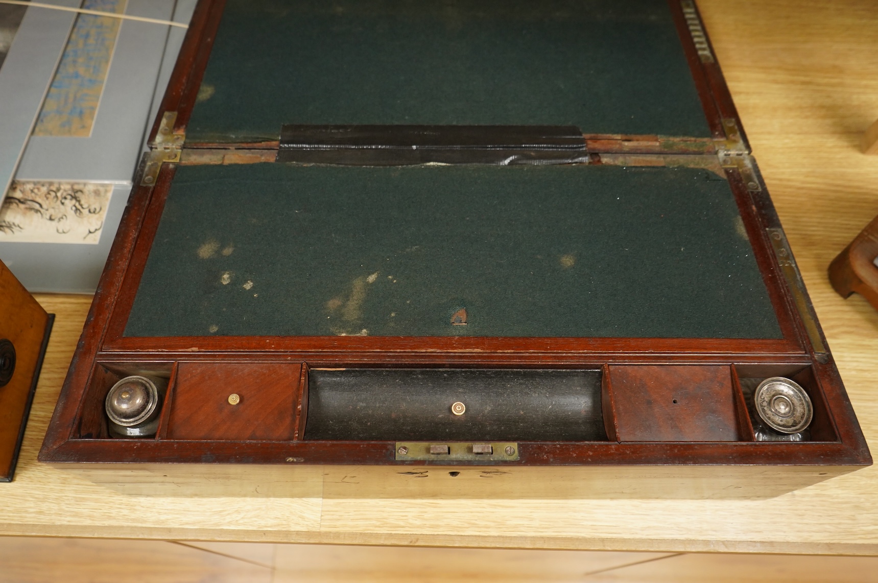 A bird’s-eye maple tea caddy and a brass mounted writing slope, latter 50cm wide